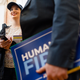 An Andrew Yang supporter, Katie Weis, 28, of Omaha, Nebraska, waits to have a photo taken with the candidate.